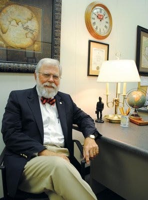 War veteran and geography professor James Norwood takes a break from teaching in his office in 210 Petrie Hall. Norwood has been at Auburn for four years. (Maria Iampietro / PHOTO EDITOR)