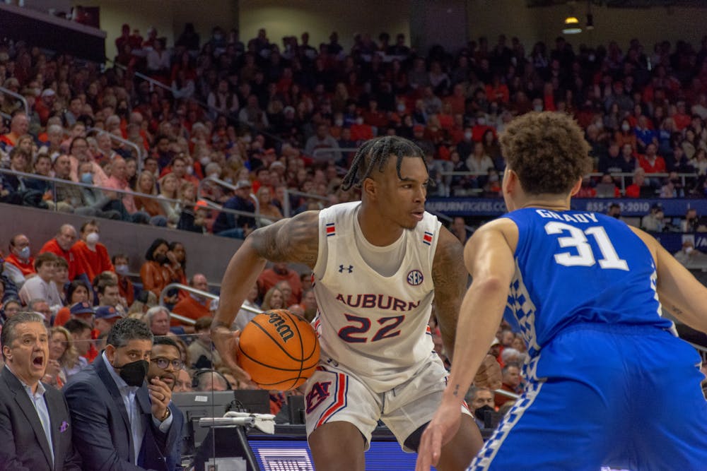 <p>Jan. 22, 2022; Allen Flanigan (22) reads the defense during a basketball game against Kentucky from Auburn Arena in Auburn, Ala.</p>