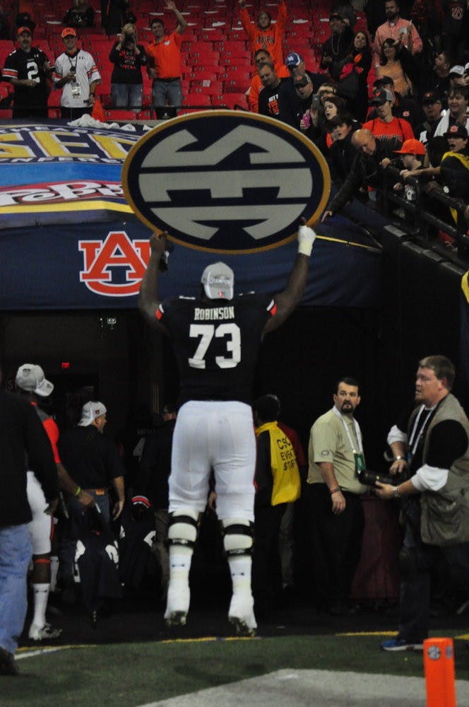 Greg Robinson celebrates as he leaves the field at the Georgia Dome. Anna Grafton / PHOTO EDITOR