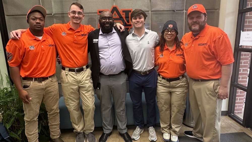 <p>Some members of the security team stand with SGA President Owen Beaverstock (third from right). Photo contributed by Ashley Gann.</p>
