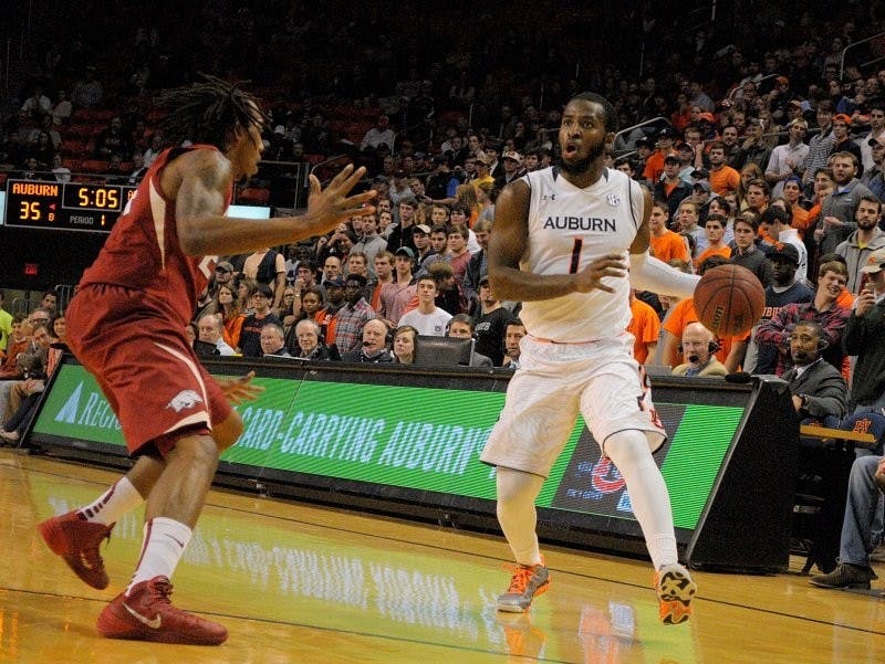 KT Harrell #1 looks for someone to pass to. Auburn vs Arkansas in Auburn, AL on Feb. 10, 2015. Adam Sparks | Photographer