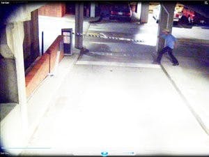 A surveillance still from the vandalism in the parking garage on Gay Street. (Courtesy of Auburn Police Department)