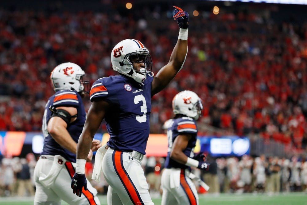 Nate Craig-Myers #3 of the Auburn Tigers celebrates a touchdown during the first half against the Georgia Bulldogs in the SEC Championship at Mercedes-Benz Stadium on December 2, 2017 in Atlanta, Georgia.