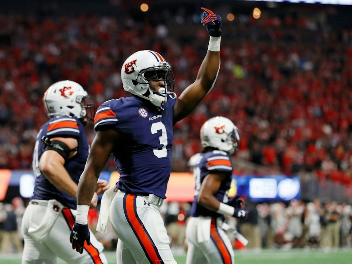 Nate Craig-Myers #3 of the Auburn Tigers celebrates a touchdown during the first half against the Georgia Bulldogs in the SEC Championship at Mercedes-Benz Stadium on December 2, 2017 in Atlanta, Georgia.
