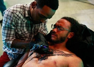 Melvin Todd performs his first "Ink" challenge on Oxygen's 'Best Ink.' (Courtesy of Oxygen Media / Ben Cohen)