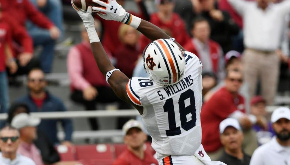 <p>Seth Williams (18) hauls in a touchdown during Auburn at Arkansas on Oct. 19, 2019, in Fayetteville, Ark.</p>