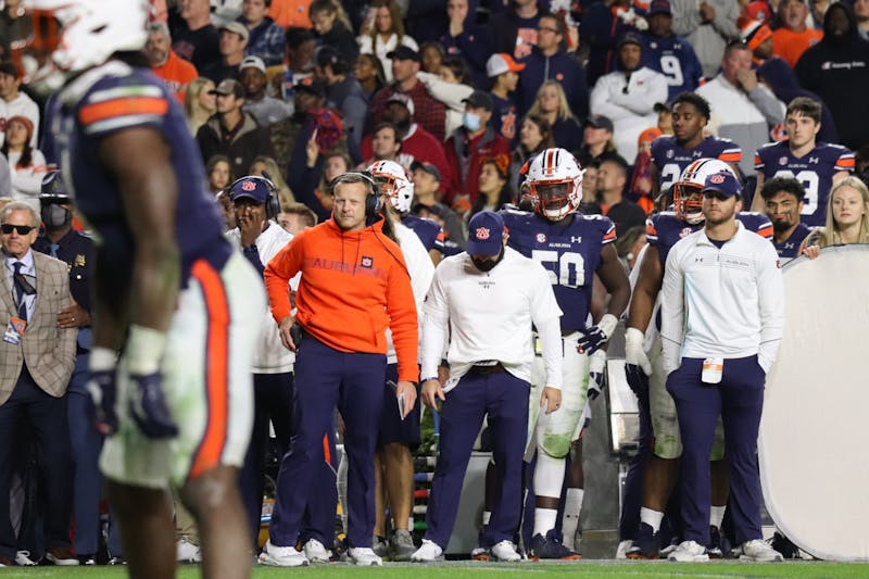 Coach Bryan Harsin watches his players from the sidelines during Auburn vs Alabama, on Nov. 27, 2021, in Auburn, Ala.