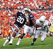 Cameron Artis-Payne (above, No. 44) and Corey Grant (below, No. 20) sprint in Auburn's season openers.