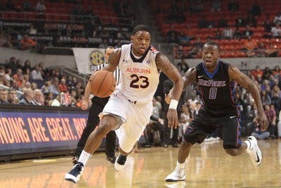 Frankie Sullivan moves up the court to score two of his 28 points, his career high. (Rebecca Croomes / PHOTO EDITOR)
