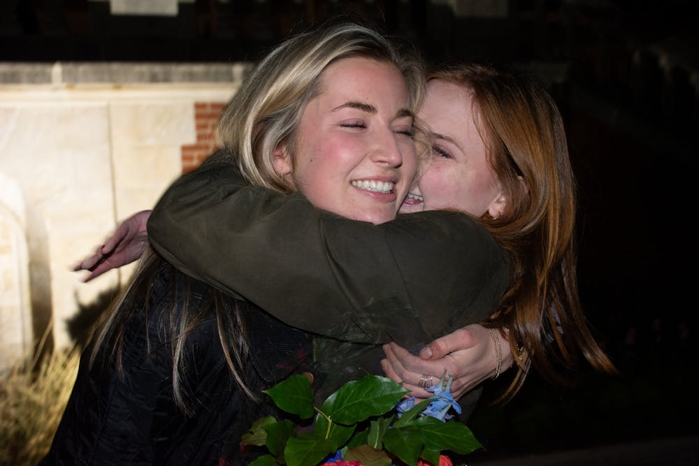 <p>Miss Auburn Kate Preston and former SGA vice president Coleman Turnipseed embrace after callouts.&nbsp;</p>