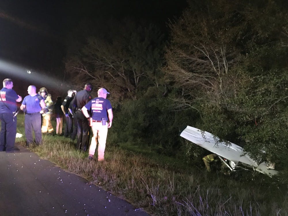 <p>First responders on the site of a plane crash off of I-85 on Oct. 16, 2018.</p>