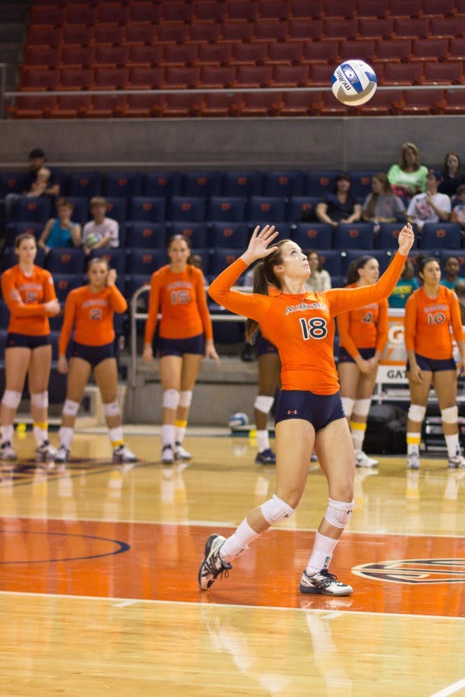 Alyssa Ivey prepares to serve the ball during the Volleyball game in the Auburn Arena on October 20, 2013. (Jenna Burgess / ASSOCIATE PHOTO EDITOR)