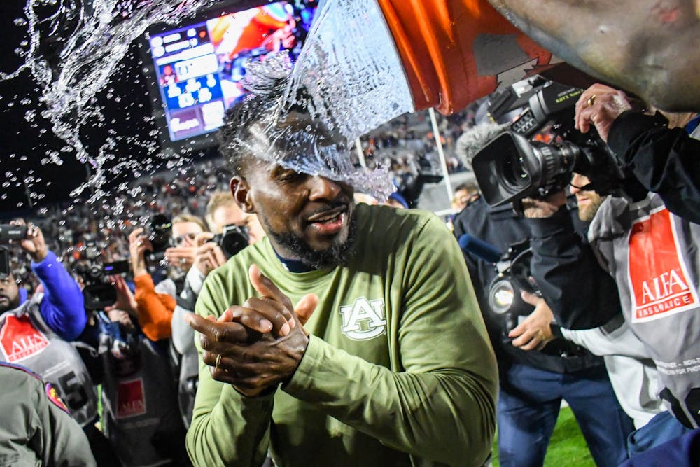 <p>Auburn interim head coach Cadillac Williams gets drenched in gatorade after defeating the Texas A&amp;M Aggies in Jordan-Hare Stadium on Nov. 12, 2022.</p>