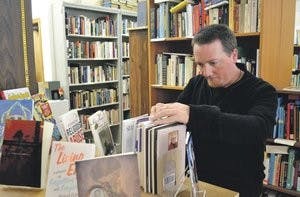 Writer Jason Crane stopped in Auburn briefly on a tour earlier in 2012 and loved the town so much he decided to move here. He has been hired by The Gnu's Room. (Danielle Lowe / ASSISTANT PHOTO EDITOR)