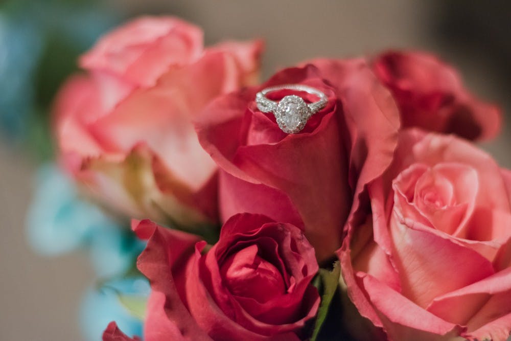 <p>A Verragio diamond engagement ring sits on top of a vase of roses on Monday, Feb. 5, 2018, in Auburn, Ala.</p>