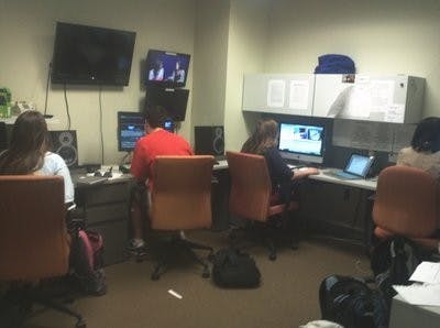 Falin WIlliams, Devon Dalton, Sara Hopkins and Courtney Davis work on various aspects of post-production in the Eagle Eye office. (Raye May / PHOTO EDITOR)