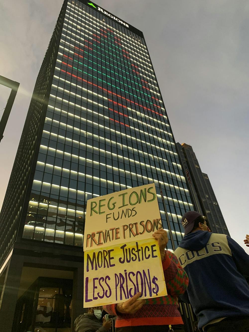 <p>Students protest outside of Regions Bank in Birmingham, Ala. on Dec. 28, 2020, for the bank's investment in CoreCivic, a private prison development company.</p>