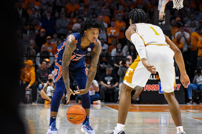 Zep Jasper (12) looks for an offensive play during a match between Auburn and Tennessee in the Thompson-Boling Arena on Feb. 26, 2022.