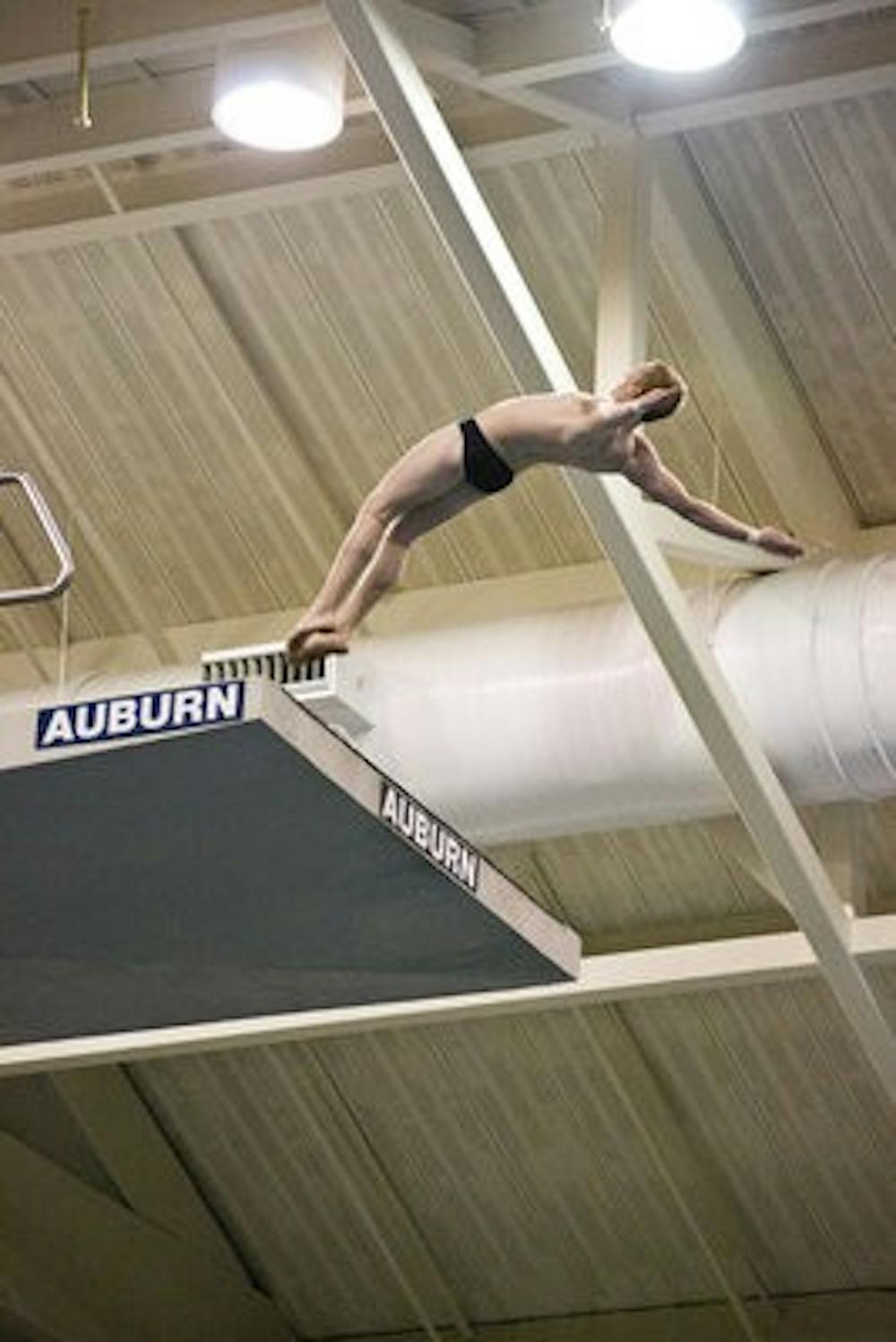 The Auburn swimming and diving teams practice before the invitational. (File photo)