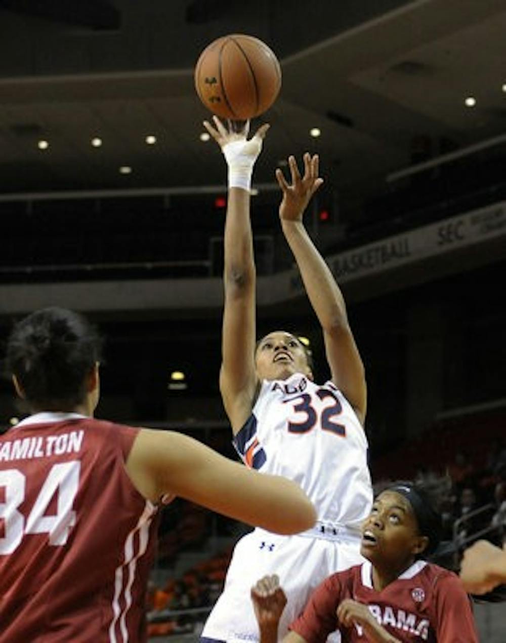 Auburn's Tyrese Tanner shoots over Alabama's Oceana Hamilton and Daisha Simmons in the first half of their basketball game on Thursday, February 27, 2014 in Auburn, Ala. (Contributed by Anthony Hall)