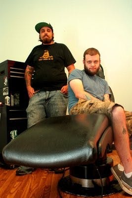 Mitch Gooden (left) and Aaron Pollack (right) opened Flying Tiger Body Modification on South College Street Sept. 15. (Rebecca Croomes / Photo Staff)