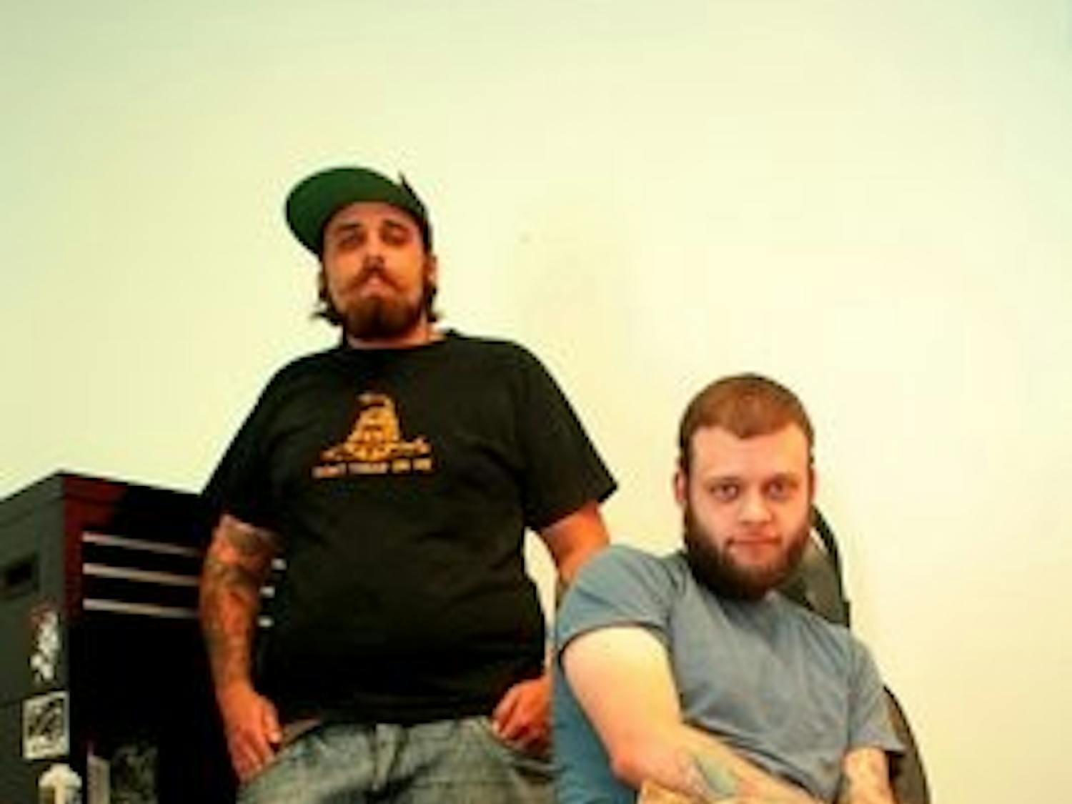 Mitch Gooden (left) and Aaron Pollack (right) opened Flying Tiger Body Modification on South College Street Sept. 15. (Rebecca Croomes / Photo Staff)