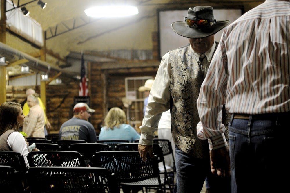 Members of the Cowboy Church greet each other on April 22, 2018, in Waverly, Ala.
