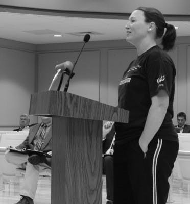 Jennifer Foster, right, attended the Auburn City Council meeting to show her concern about the possibility that a bar could be built so close to a day care.