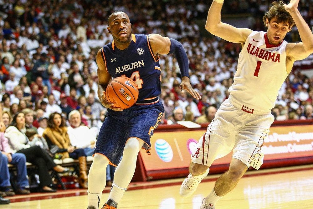 <p>Antoine Mason drives to the basket during a game at Alabama this season. (Kenny Moss | Assistant Photo Editor)</p>