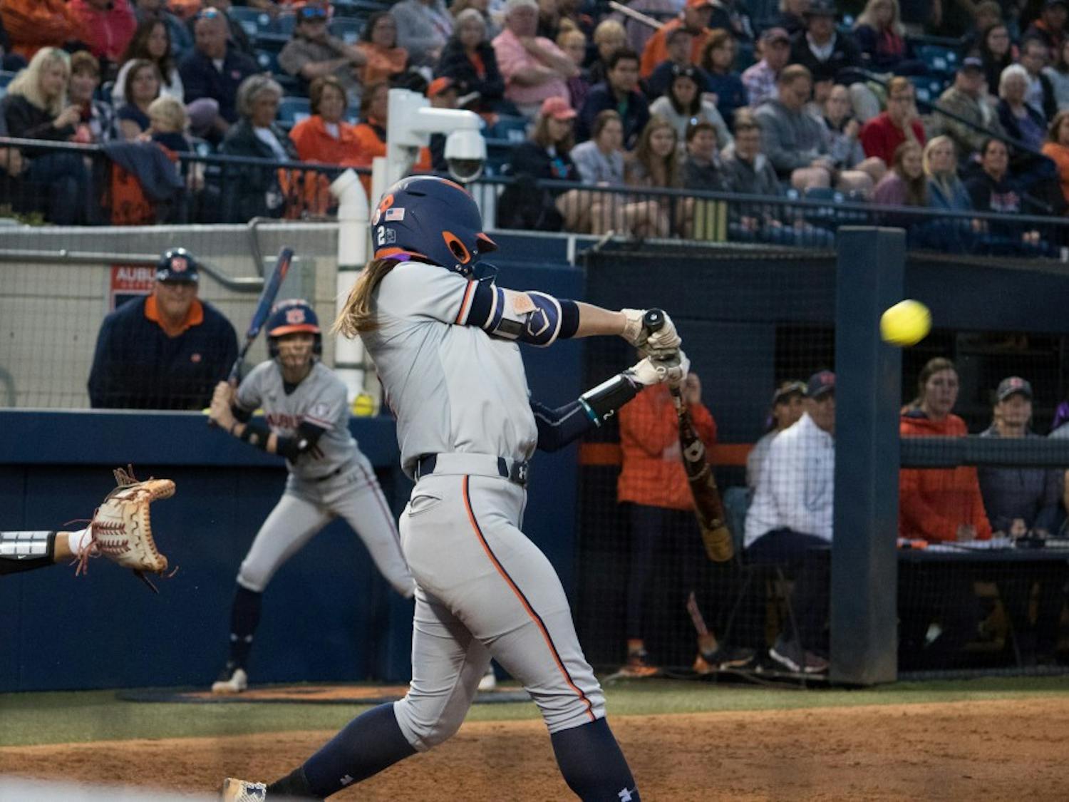 Taylon Snow (2) hits the ball for Auburn Softball against Arkansas Friday, April 20, 2018, in Auburn, Ala. 