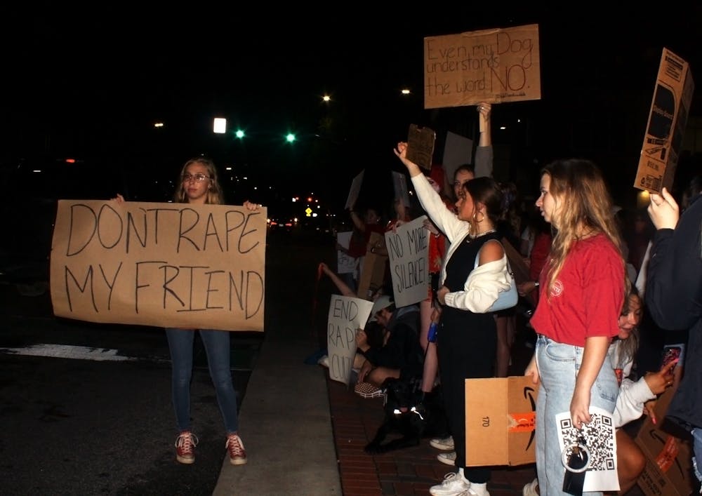 <p>Auburn students gather to protest recent sexual assaults on Sept. 14th, 2021, on Toomer's Corner in Auburn, Ala.</p>