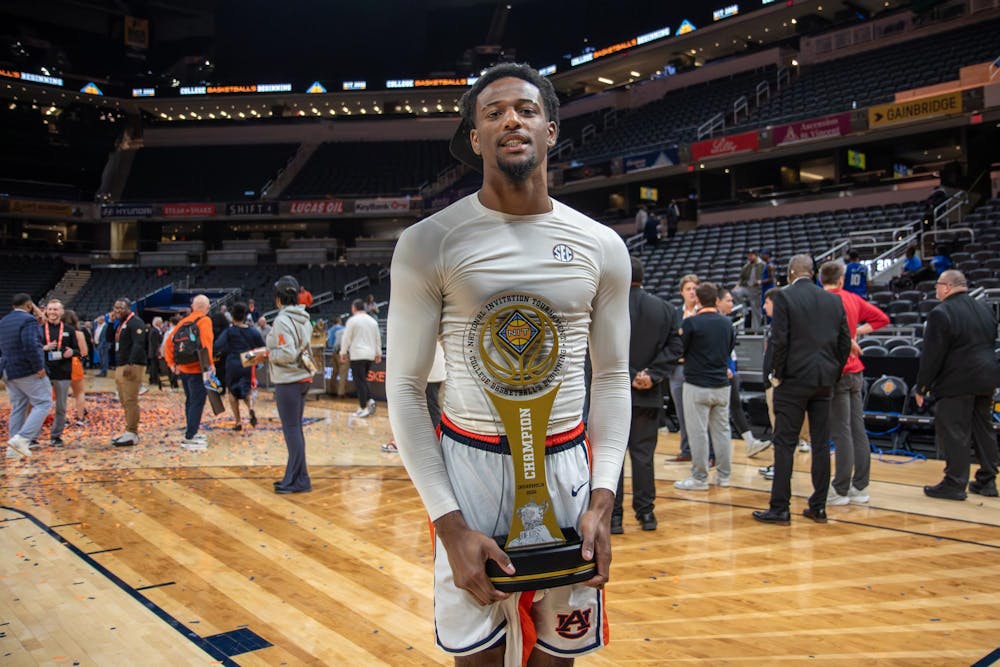 <p>Kevin Overton holds trophy in celebration of winning the NIT championship game against Tulsa in Gainbridge Fieldhouse in Indianapolis, Ind on April 5, 2026.</p>