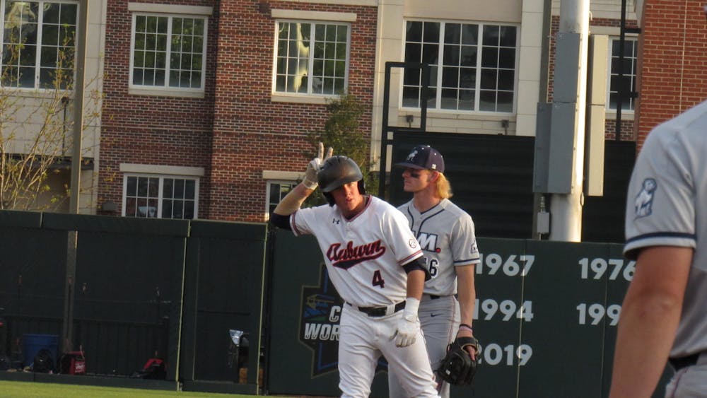 <p>Brody Moore (4) celebrates after hitting a double against Samford on April 12, 2022 in Plainsman Park in Auburn, Ala.</p>