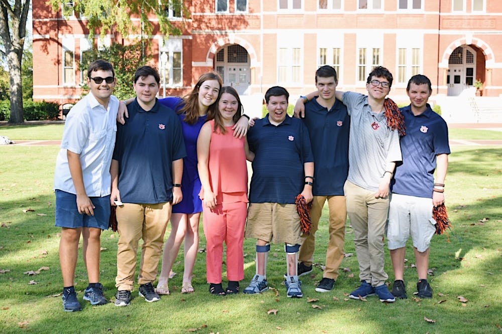 <p>EAGLES program students pose for a photo in front of Samford Hall in Auburn, Ala.</p>