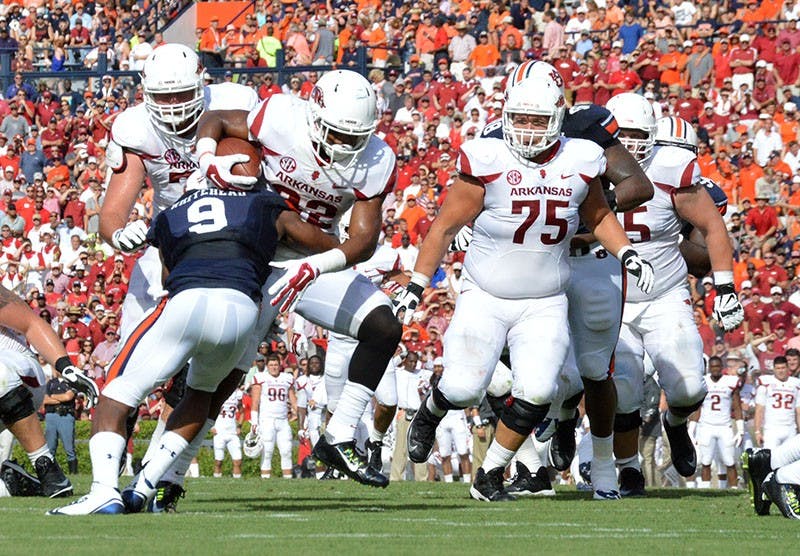 Jermaine Whitehead (#9) blocks. Auburn vs. Arkansas, August 30, 2014. (Emily Enfinger | Assistant Photo Editor)