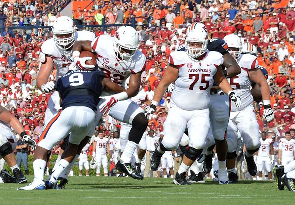 Jermaine Whitehead (#9) blocks. Auburn vs. Arkansas, August 30, 2014. (Emily Enfinger | Assistant Photo Editor)