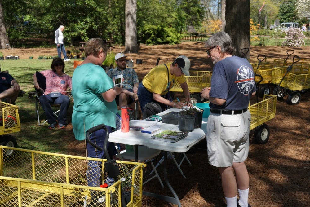 Attendees look to purchase different plants at the Azalea Festival at Auburn University's Donald E. Davis Arboretum on Saturday, March 31, 2018, in Auburn, Ala.