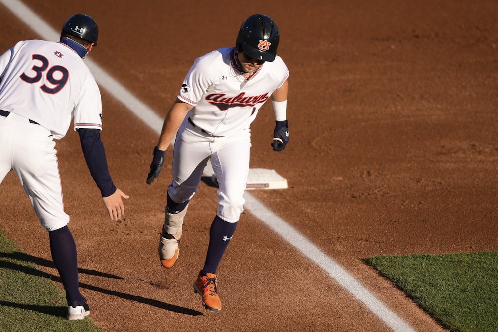 Feb 23, 2021; Auburn, AL, USA; Auburn Tigers outfielder Judd Ward (1) rounds third base on his way to home to score a run during the game between Auburn and Alabama A&M at Plainsman Park. Mandatory Credit: Shanna Lockwood/AU Athletics
