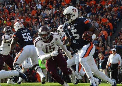 Ricardo Louis #5 runs with ball. Texas A&M's vs. Auburn at Auburn, Ala. on Nov 8, 2014. (Emily Enfinger | Assistant Photo Editor)
