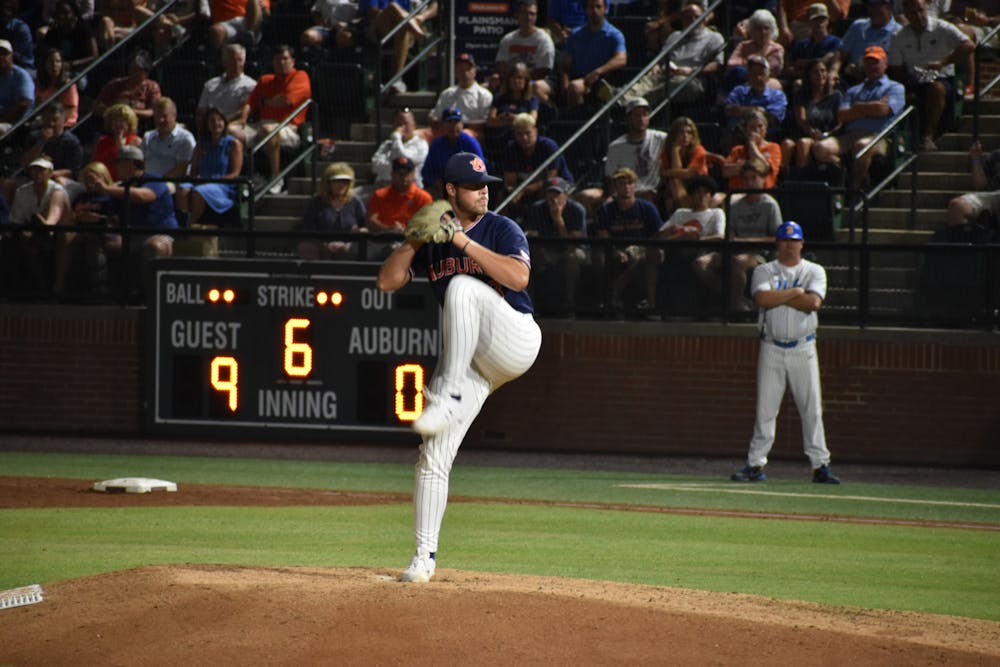 <p>Pitcher Mason Barnett throws to a UCLA batter just minutes before the game was suspended due to inclement weather.&nbsp;</p>