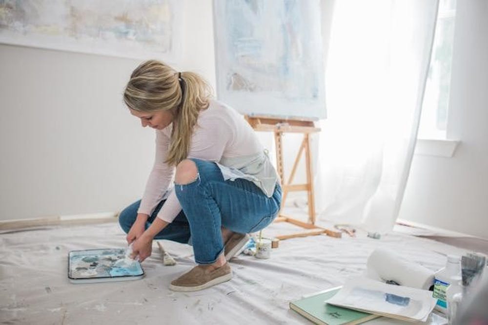 <p>Lauren Woods photographed working on one of her pieces.</p>