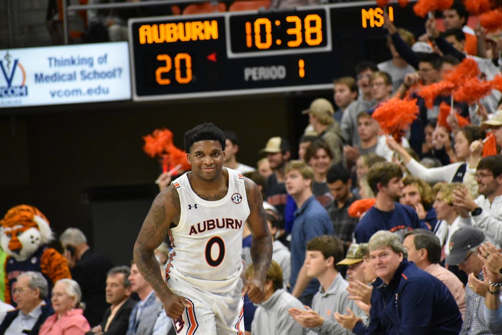 <p>Nov. 9, 2021; Auburn, Alabama; K.D. Johnson (0) smiles at an opposing player in a match against Morehead State.</p>