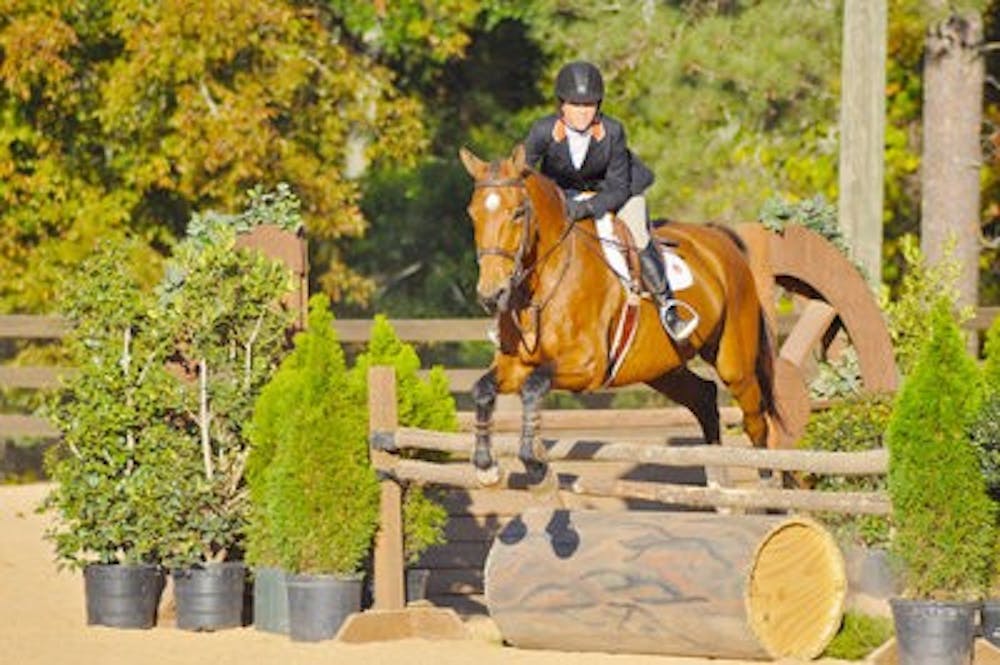 Dottie Grubb competes in hunt seat over fences at home against Georgia Nov. 12. (Kelly Tsaltas / Photo Staff)