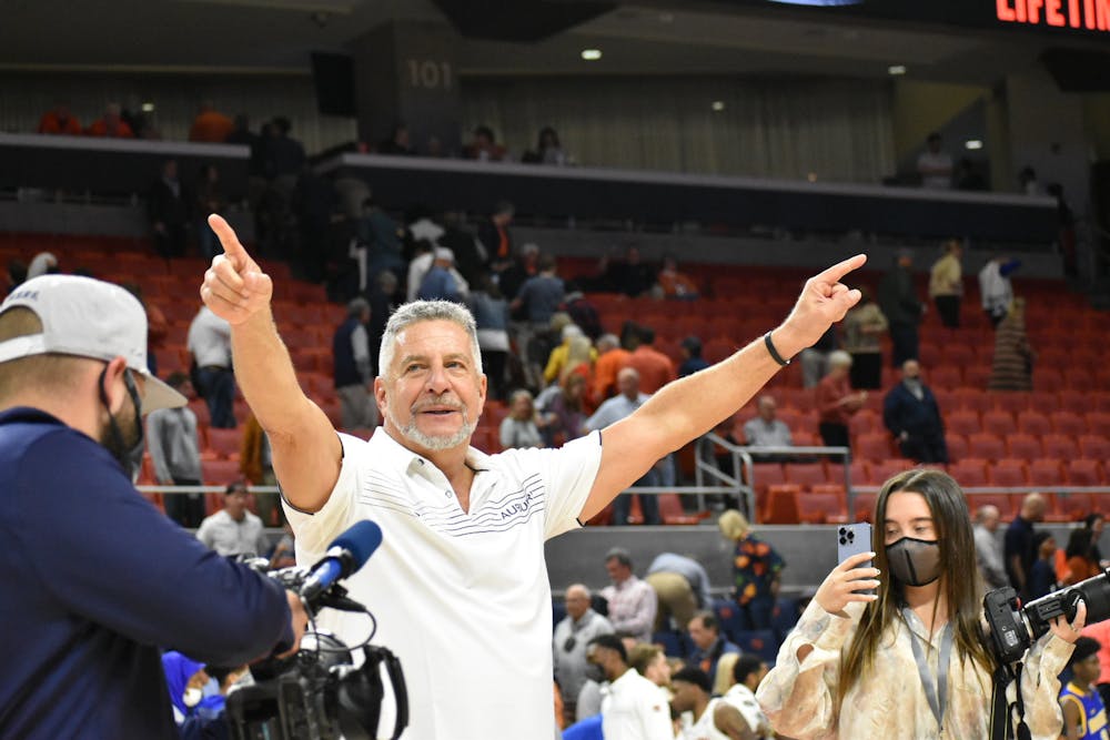 <p>Nov. 9, 2021; Auburn, Alabama; Bruce Pearl celebrates with fans after a match between Auburn and Morehead State.</p>