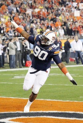 Nick Fairley flys across the field before the game. (Emily Adams/PHOTO EDITOR)