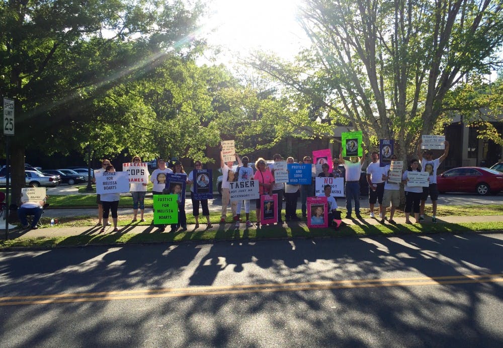 Melissa Boarts' family and others protest her shooting death officers outside the Douglas J. Watson Municipal Complex on Saturday, April 23, 2016, in Auburn, Ala. Boarts was shot and killed by Auburn Police Division officers on April 3.