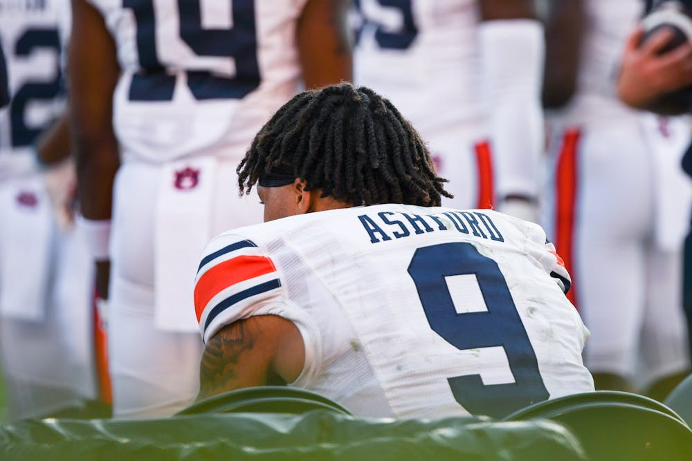 Auburn quarterback Robby Ashford (9) sits on the bench in the fourth quarter of a game against Georgia in Sanford Stadium on Oct. 8, 2022.