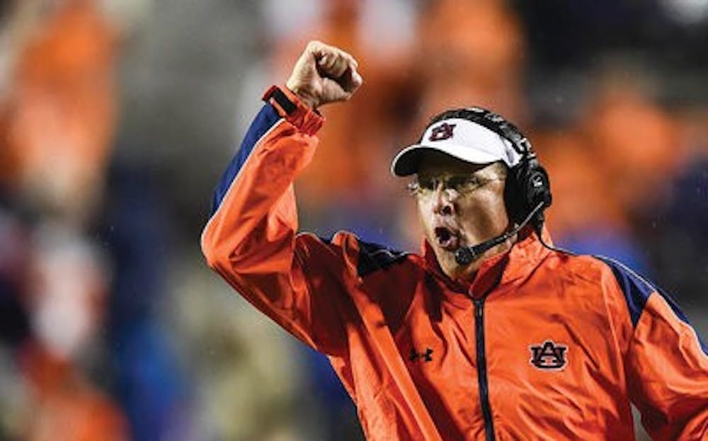 Head coach Gus Malzahn celebrates during the Tigers' victory over Arkansas. (Contributed by Auburn Athletics)