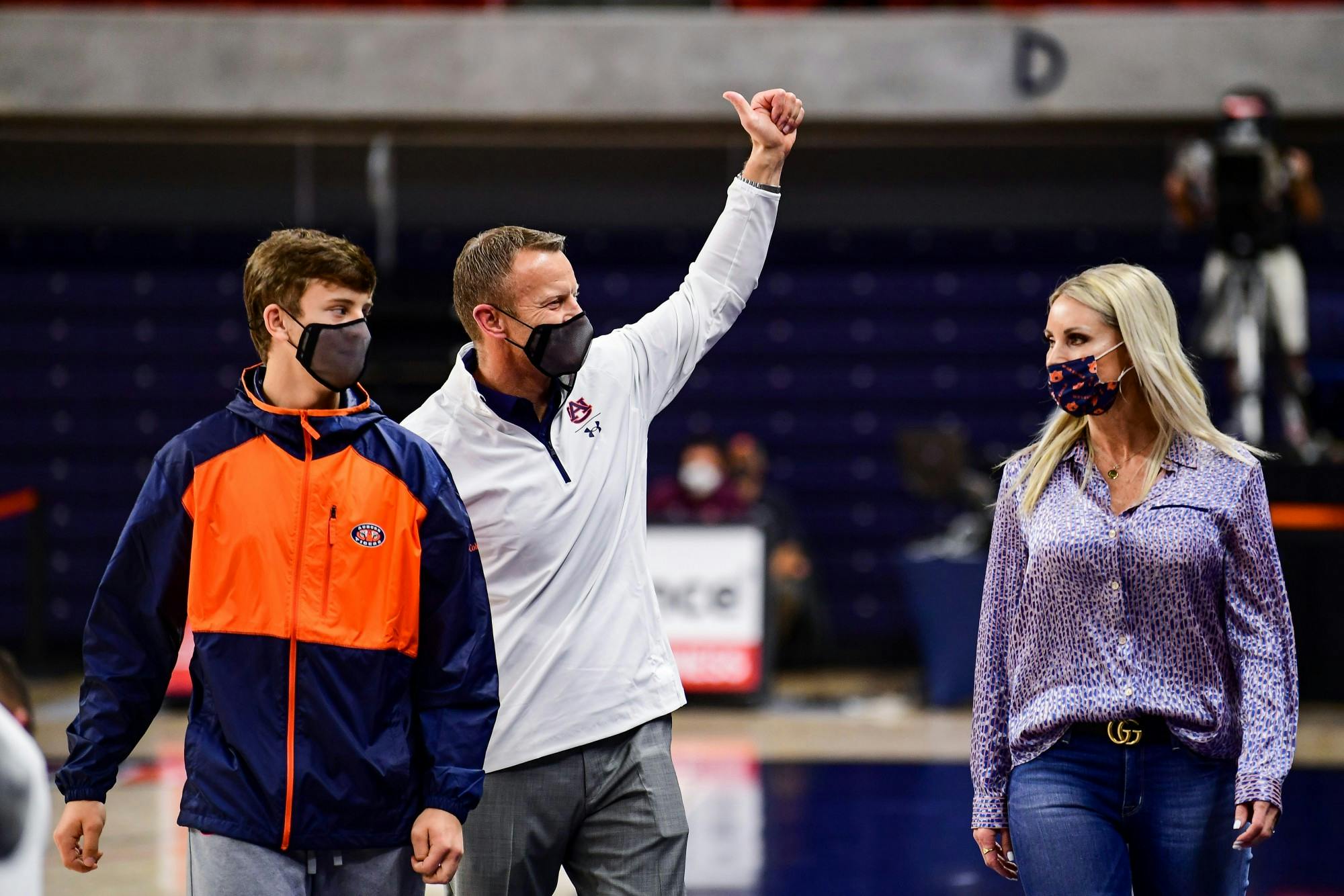 123020_Auburn_SL1_2544_Bryan Harsin, his wife, Kes Harsin, and son, Davis Harsin, attend the basketball game .jpg