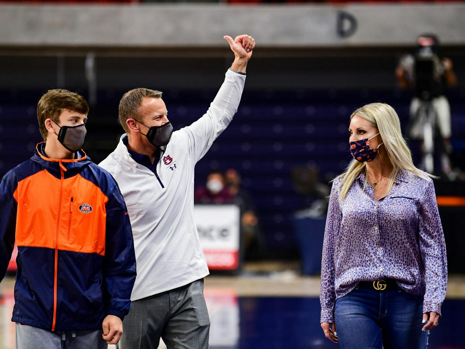 123020_Auburn_SL1_2544_Bryan Harsin, his wife, Kes Harsin, and son, Davis Harsin, attend the basketball game .jpg